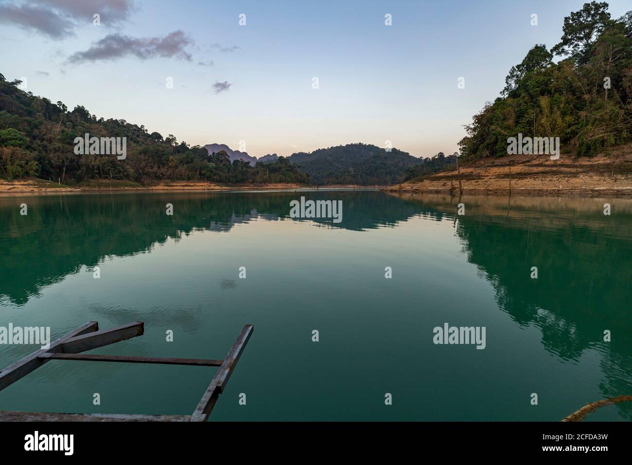 View from jetty to water of Ratchaprapha lake in the early morning in Khao Sok National Park, Khao Sok, Thailand Stock Photo