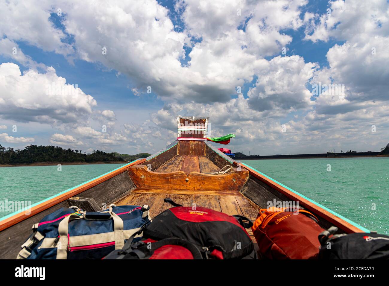 Longtail boat ride on Ratchaprapha Lake with high karst rocks in Khao Sok National Park, Khao Sok. Thailand Stock Photo