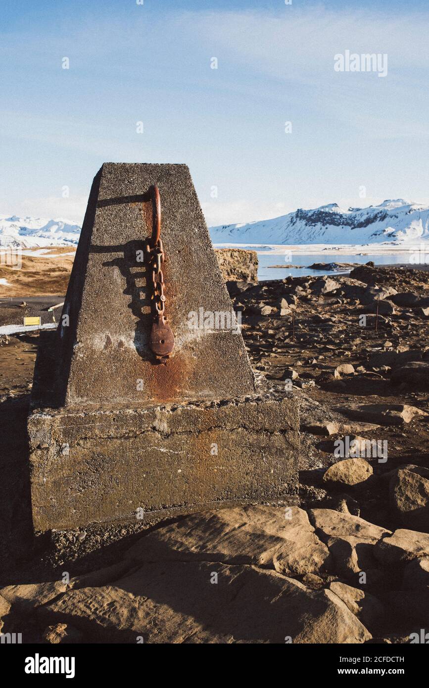 Stone sculpture with rusted lock on Cape of Dyrhólaey in winter Stock Photo
