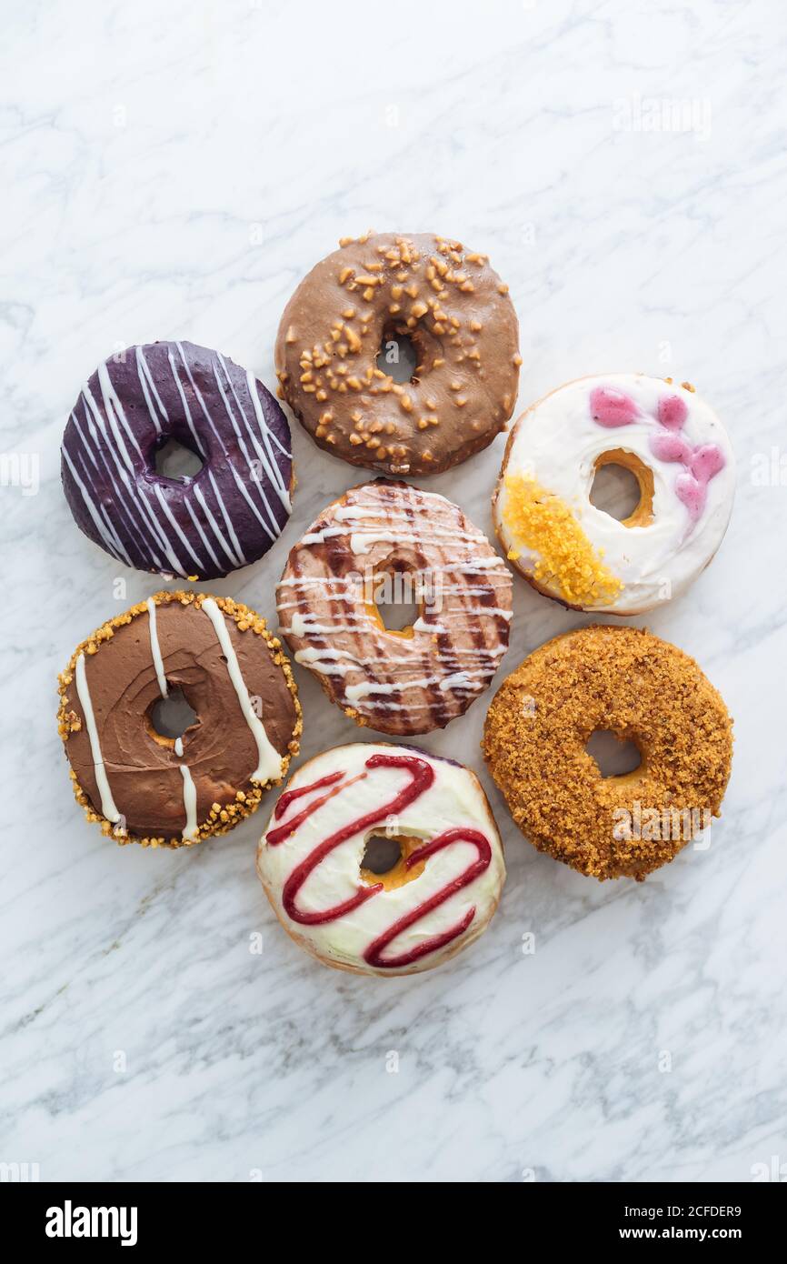 Variety of doughnuts on marble background Stock Photo