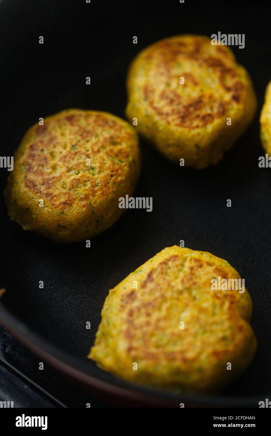 https://c8.alamy.com/comp/2CFDHAN/from-above-tasty-vegetable-cutlets-with-golden-brown-preparing-in-pan-on-stove-in-kitchen-2CFDHAN.jpg