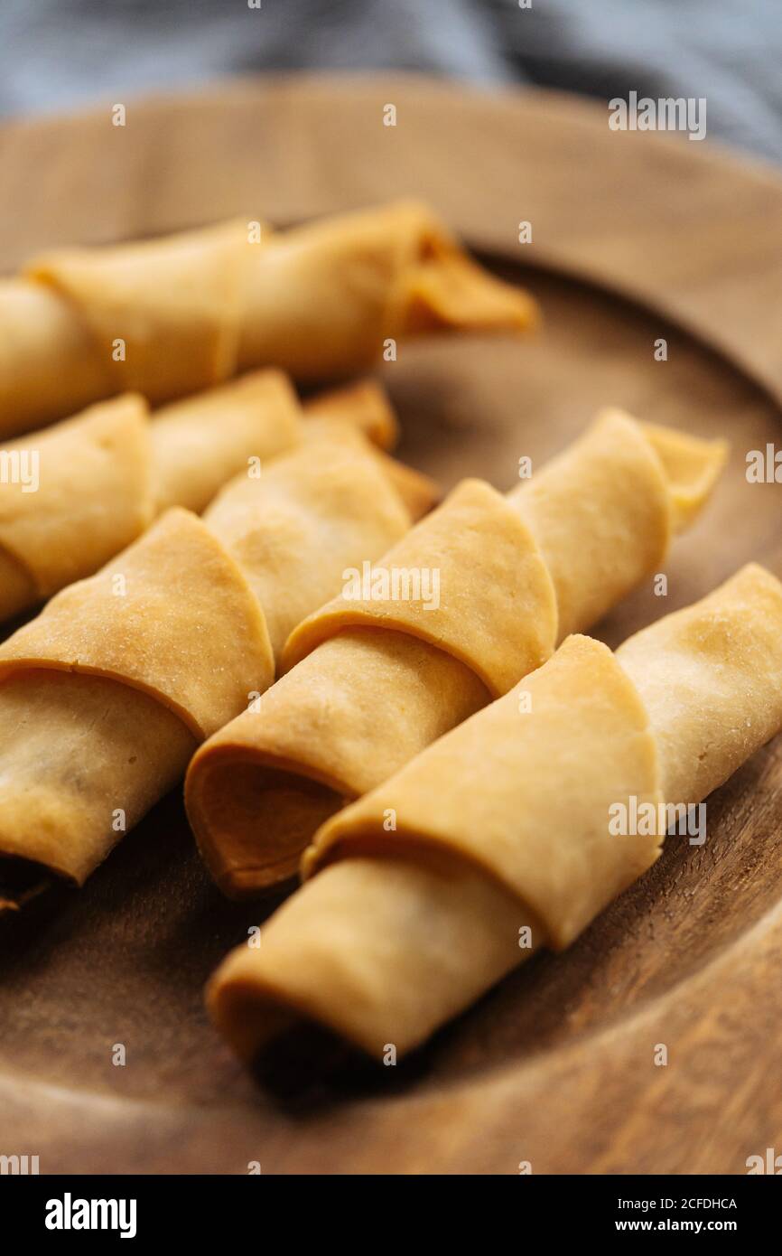 Delicious croissants with rosy sides on plate Stock Photo