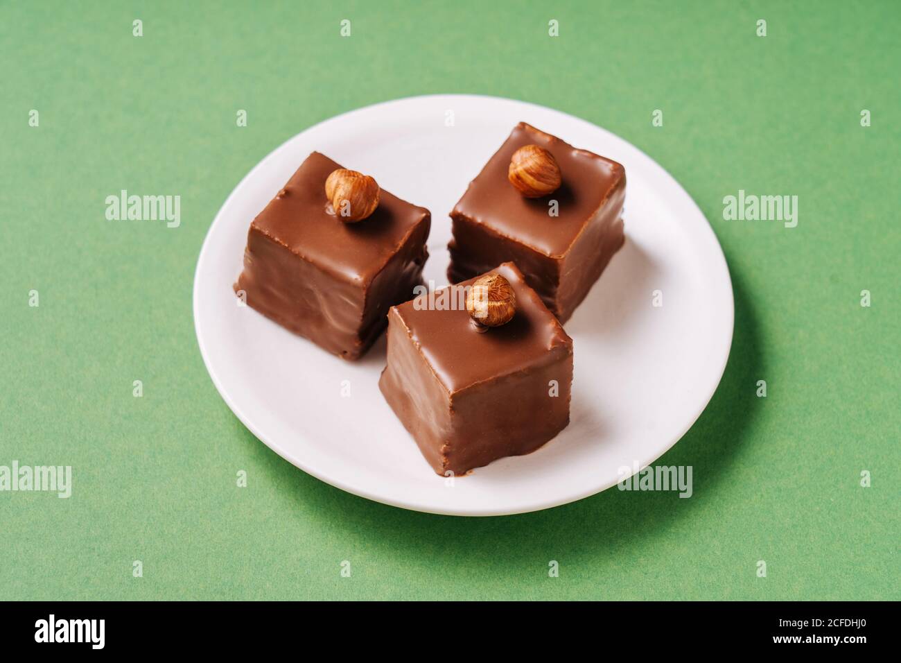 Chocolate dessert with hazelnuts on plate Stock Photo