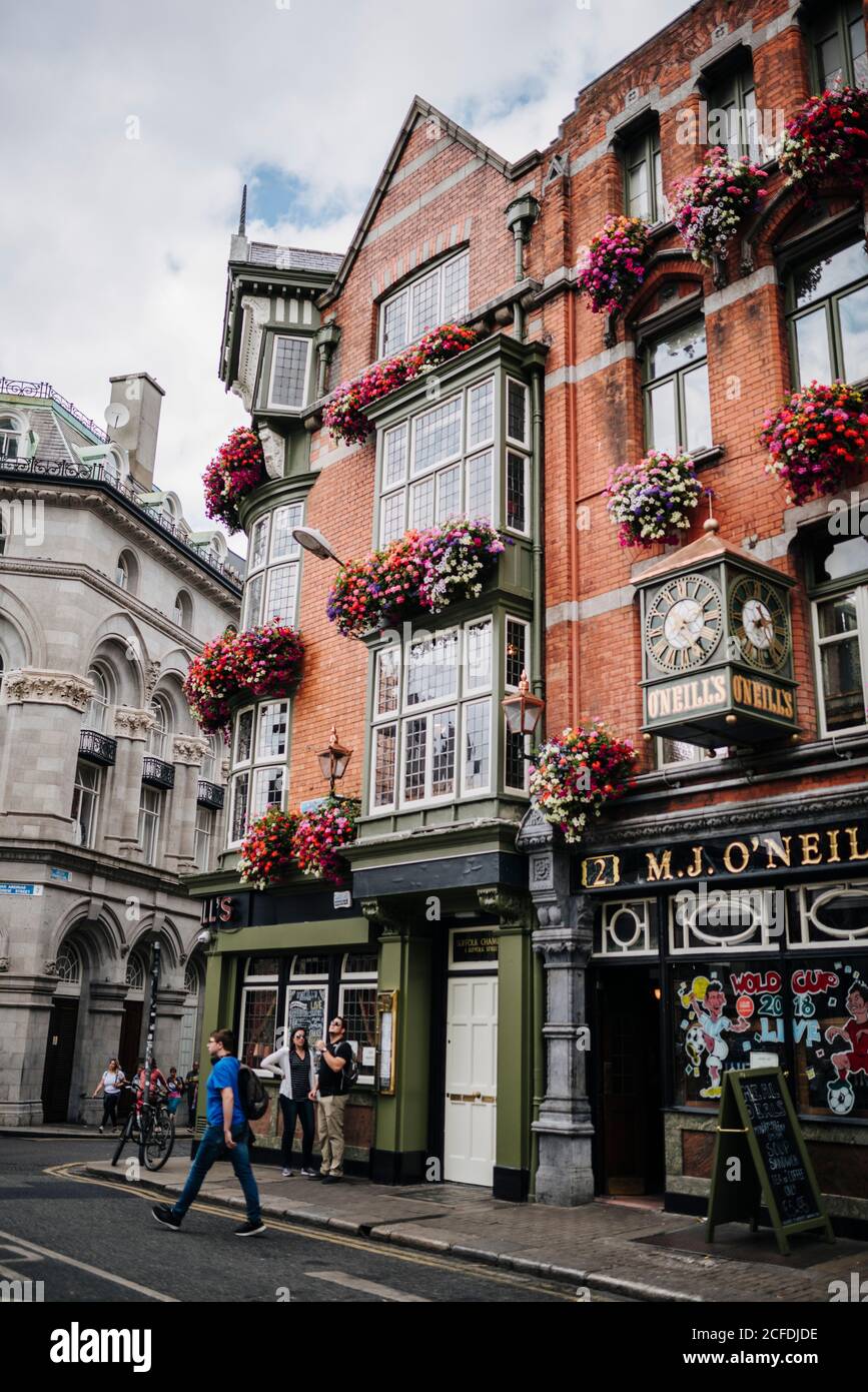 O'Neills Pub & Kitchen, traditional Irish pub, flowered house facade, Dublin, Ireland Stock Photo