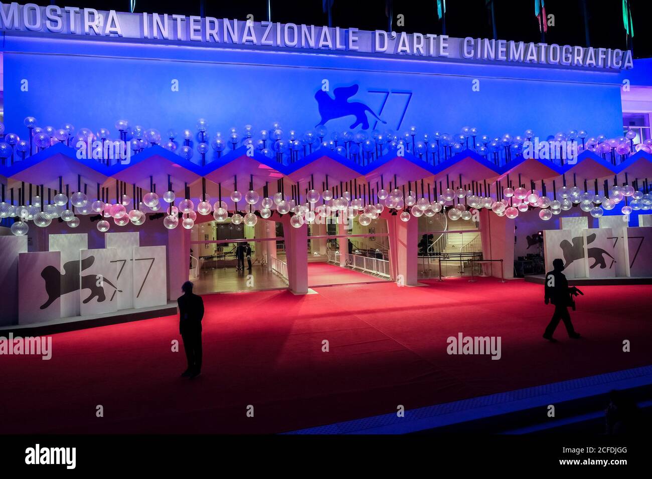 Palazzo del Cinema, Lido, Venice, Italy. 4th Sep, 2020. Atmosphere around 77th Venice International Film Festival . Before the late screening of the Duke, photographers and security wait (socially distanced with face coverings). Picture by Credit: Julie Edwards/Alamy Live News Stock Photo
