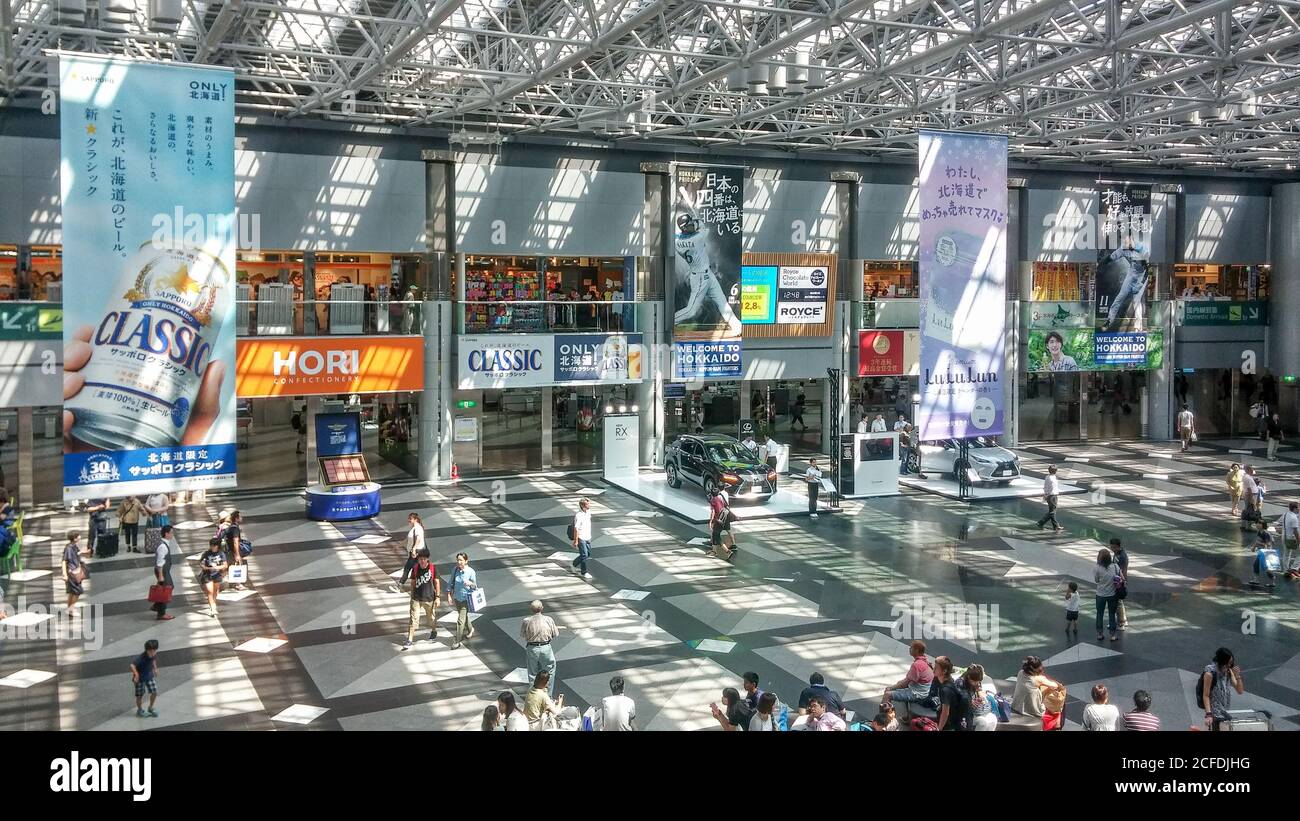 Sapporo, Hokkaido, Japan -  Domestic terminal atrium of New Chitose Airport. Advertising hanging banners about Sapporo Beer and Nippon-Ham Fighters. Stock Photo
