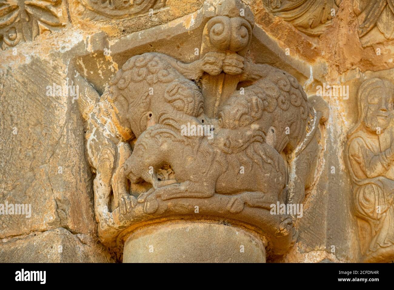 lions devouring a ram, Church of Santiago de Agüero, Agüero, Huesca, Spain. Stock Photo