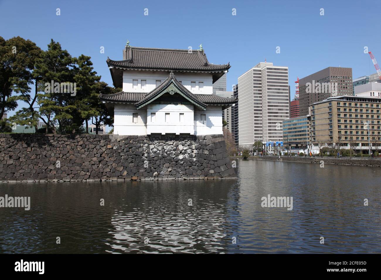 Ornate building above the moat around the Japanese Imperial Palace in Tokyo Stock Photo