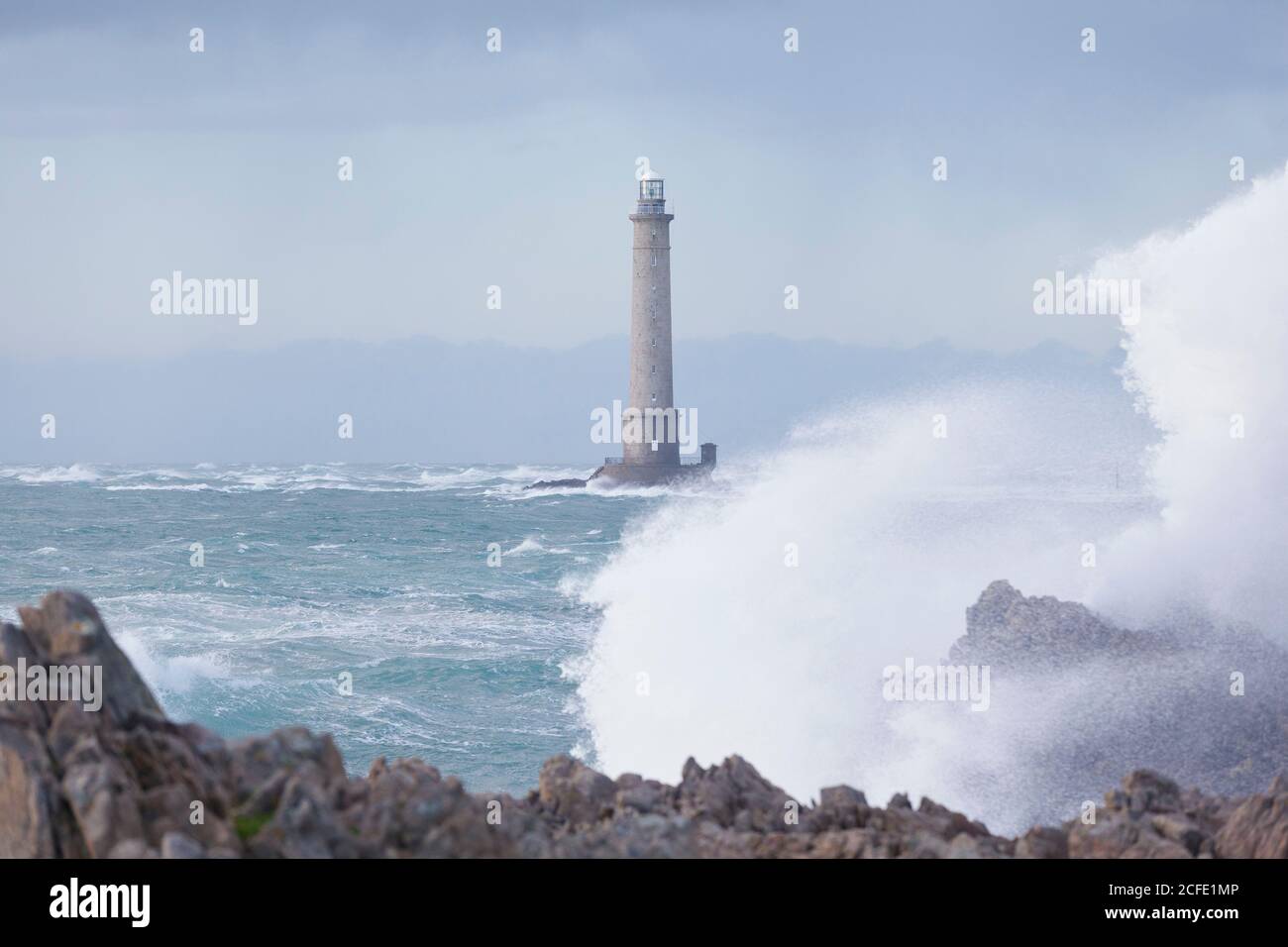 Goury lighthouse during storm, Normandy Stock Photo