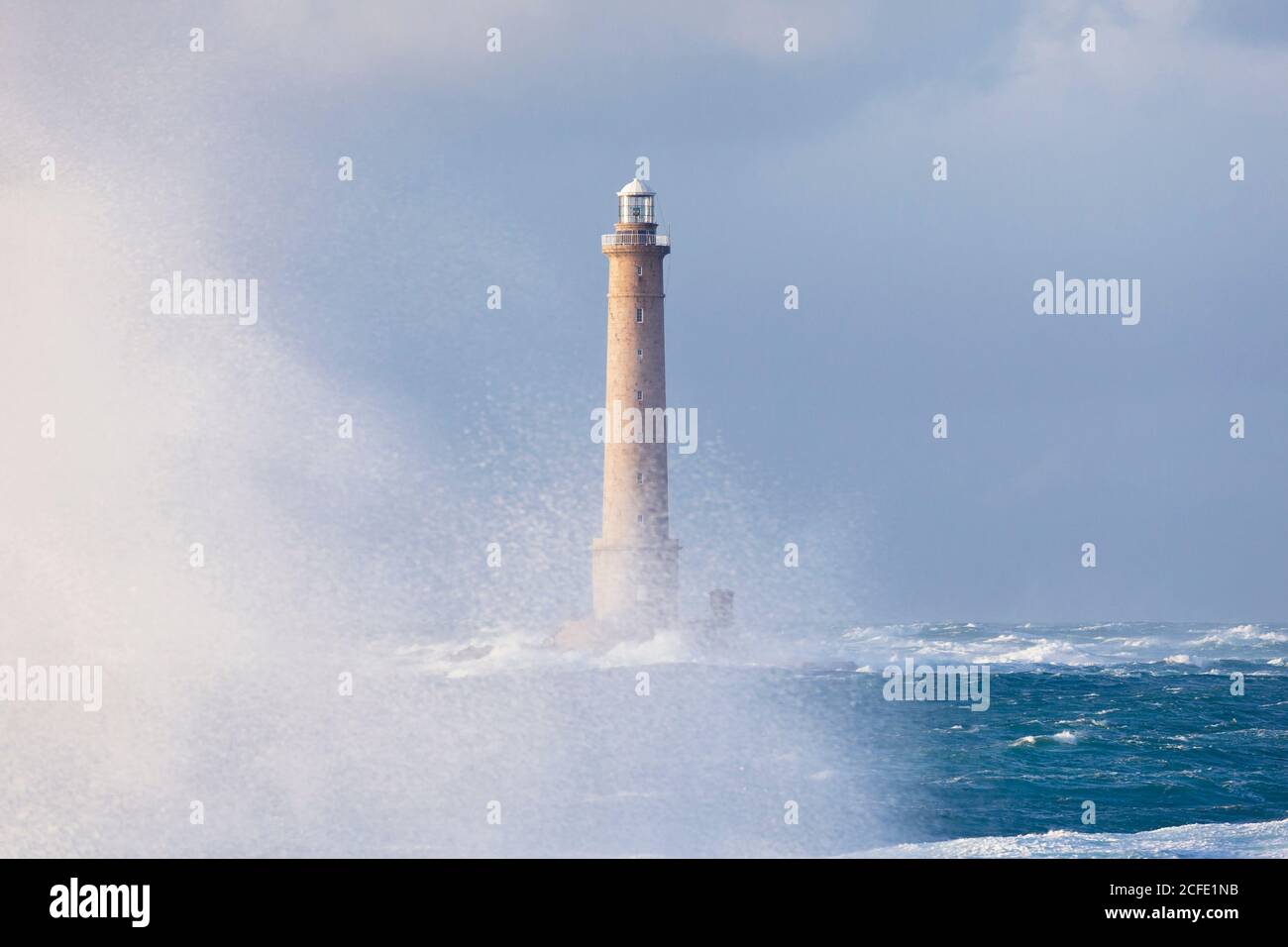 Goury lighthouse during storm, Normandy Stock Photo
