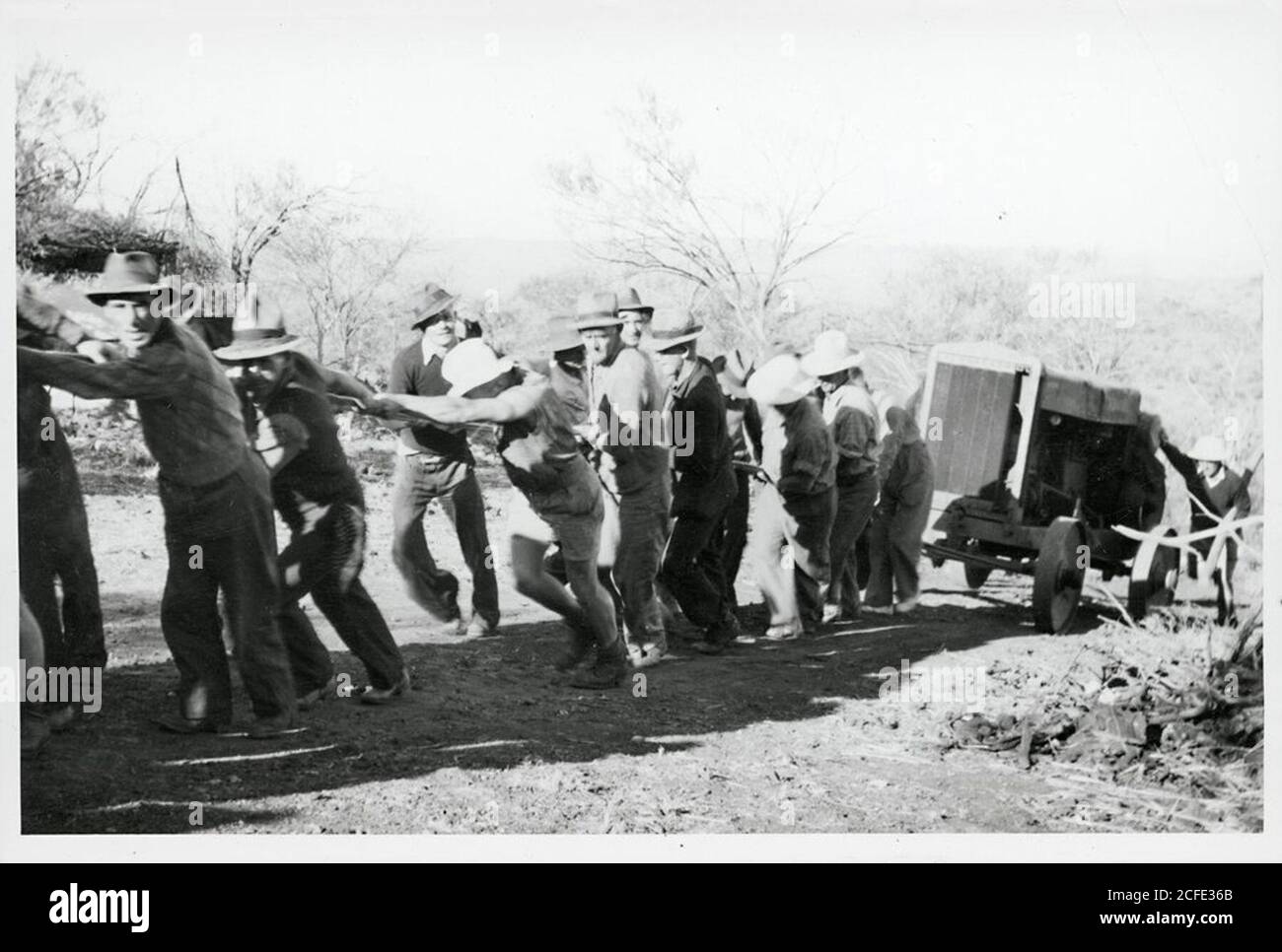 Compressor Pulling C.C.C. workers pulling air-compressor up hill Stock Photo - Alamy