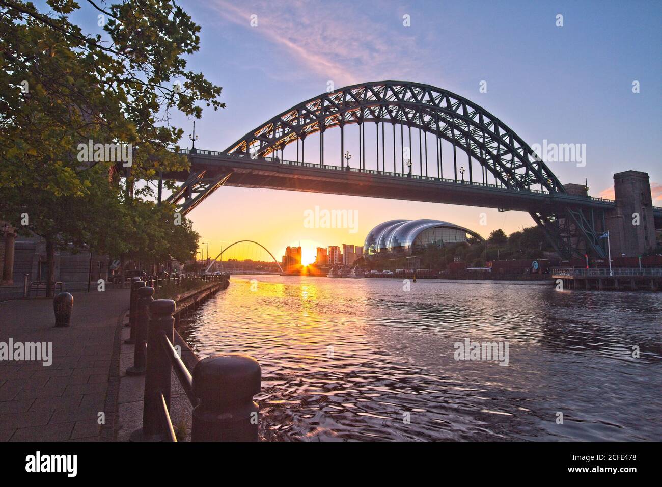The Tyne Bridge, Newcastle, Tyne and Wear captured at sunrise looking down river. Stock Photo