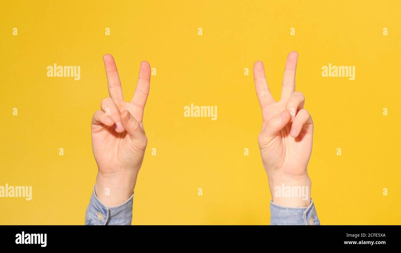 Hand showing two fingers icon hi-res stock photography and images - Alamy