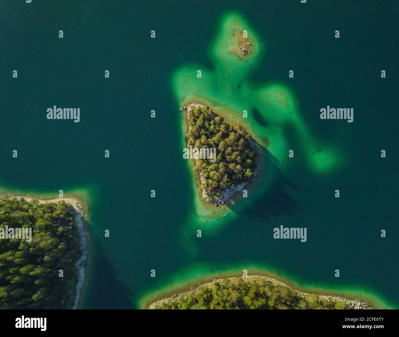 Aerial view Sasseninsel (Sassenbüchel, Roseninsel) on the Eibsee, turquoise (green) water, trees, Grainau lake shore, Garmisch-Partenkirchen, Upper Stock Photo