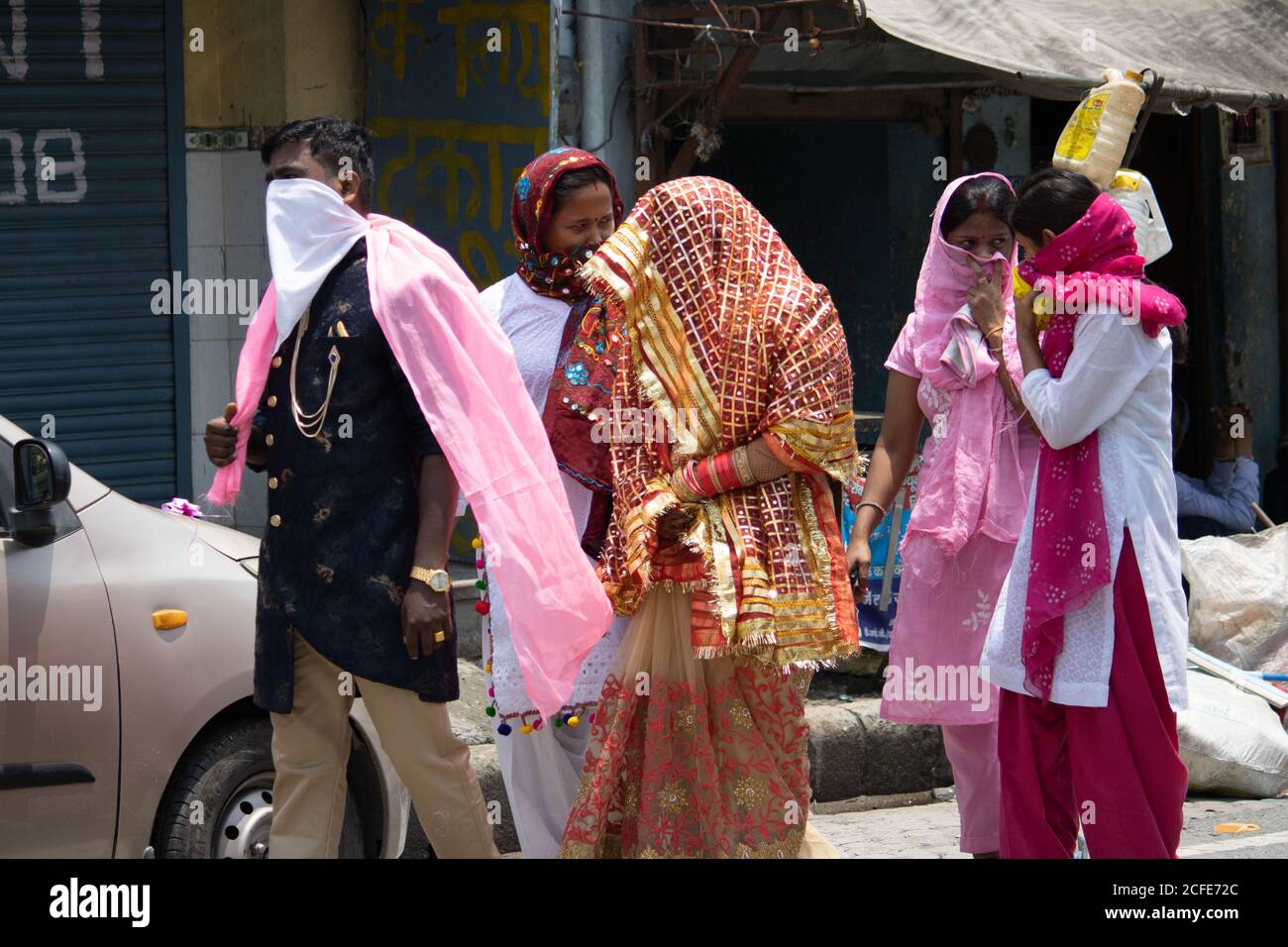Dehradun, Uttarakhand/India- August 15 2020:  A Newly married couple in covid 19 pandemic, covering their face. Stock Photo