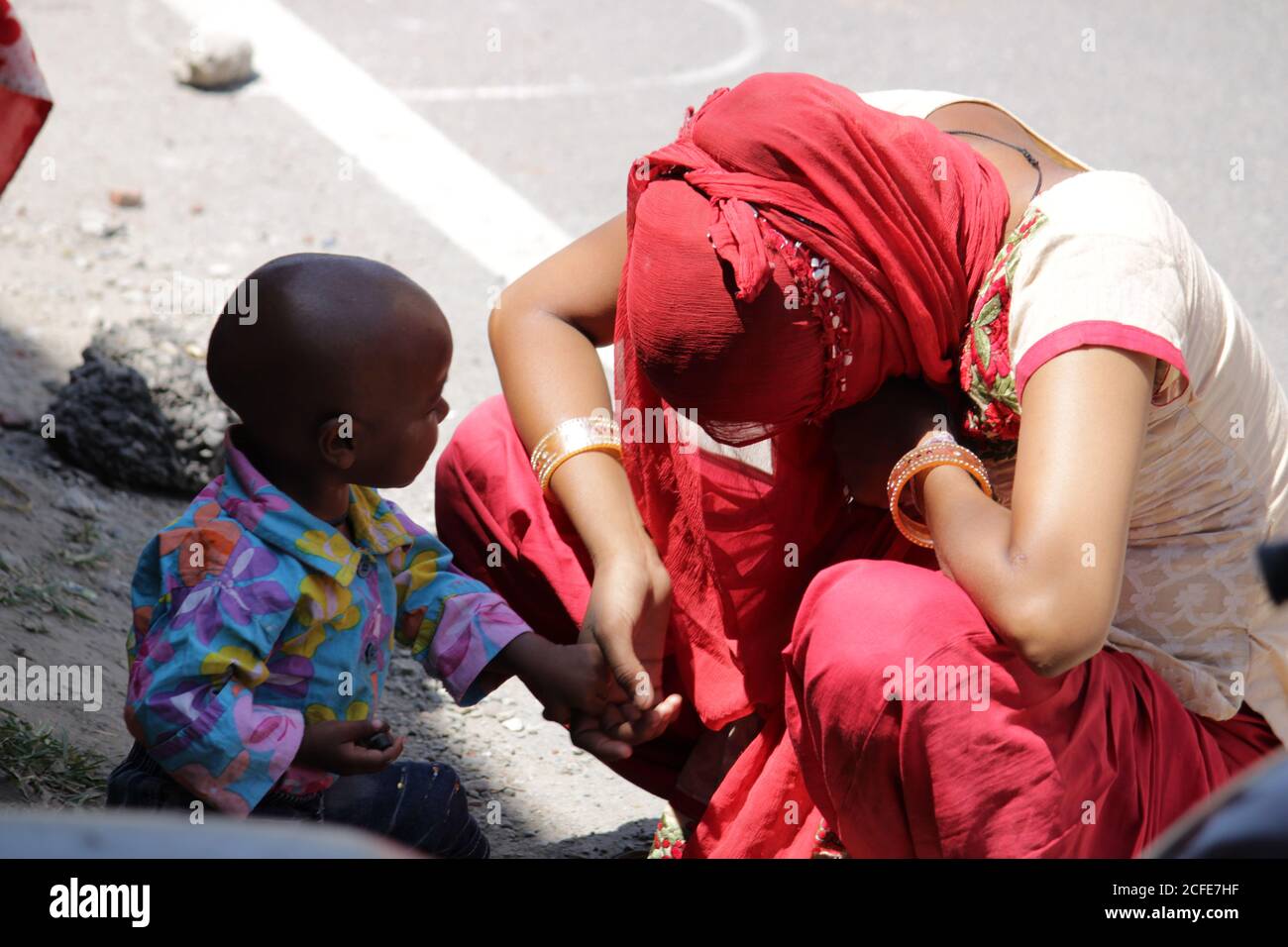 Dehradun, Uttarakhand/India - August 01 2020:Poor Indian women with her child. Stock Photo