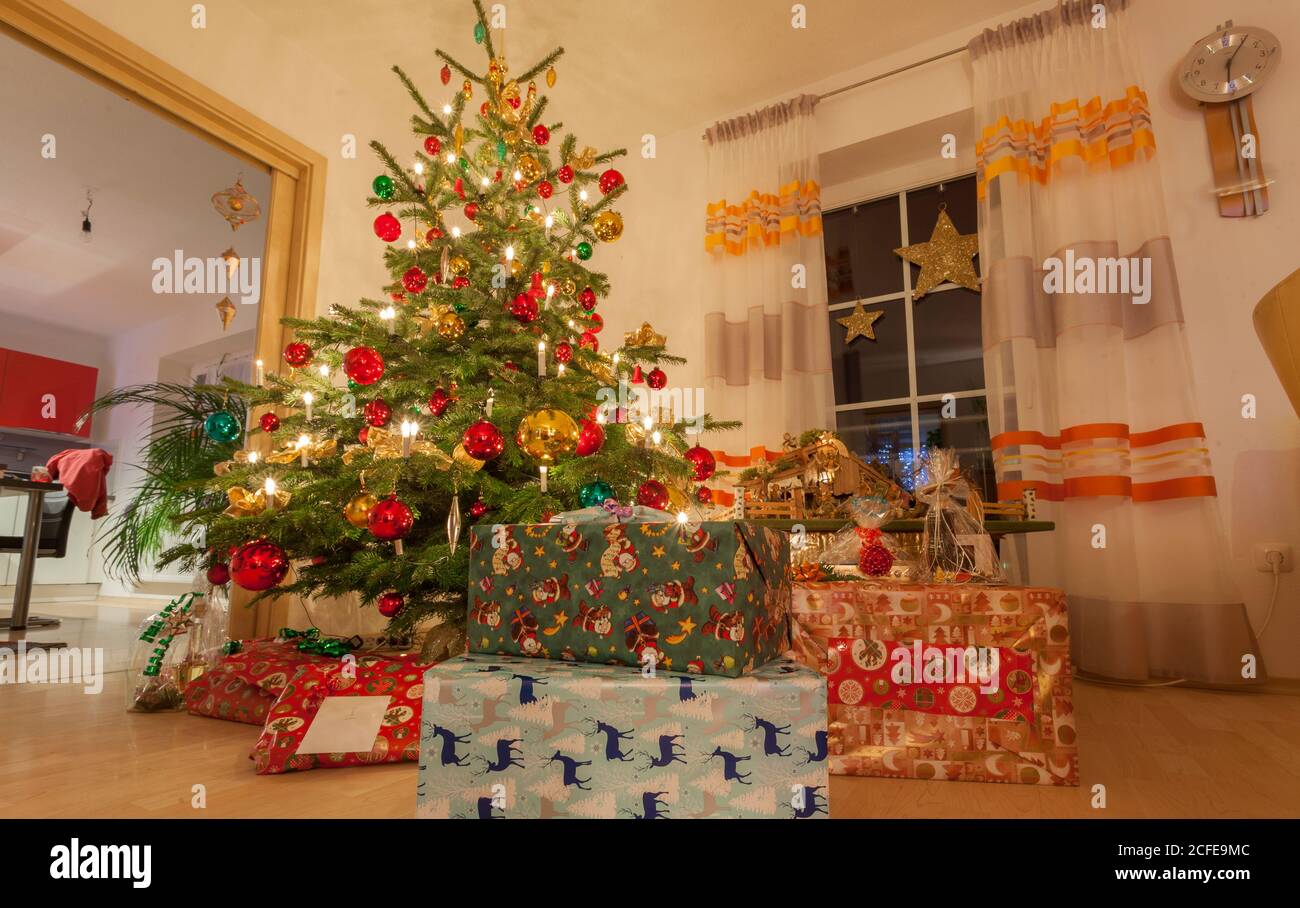 lots of christmas presents under tree