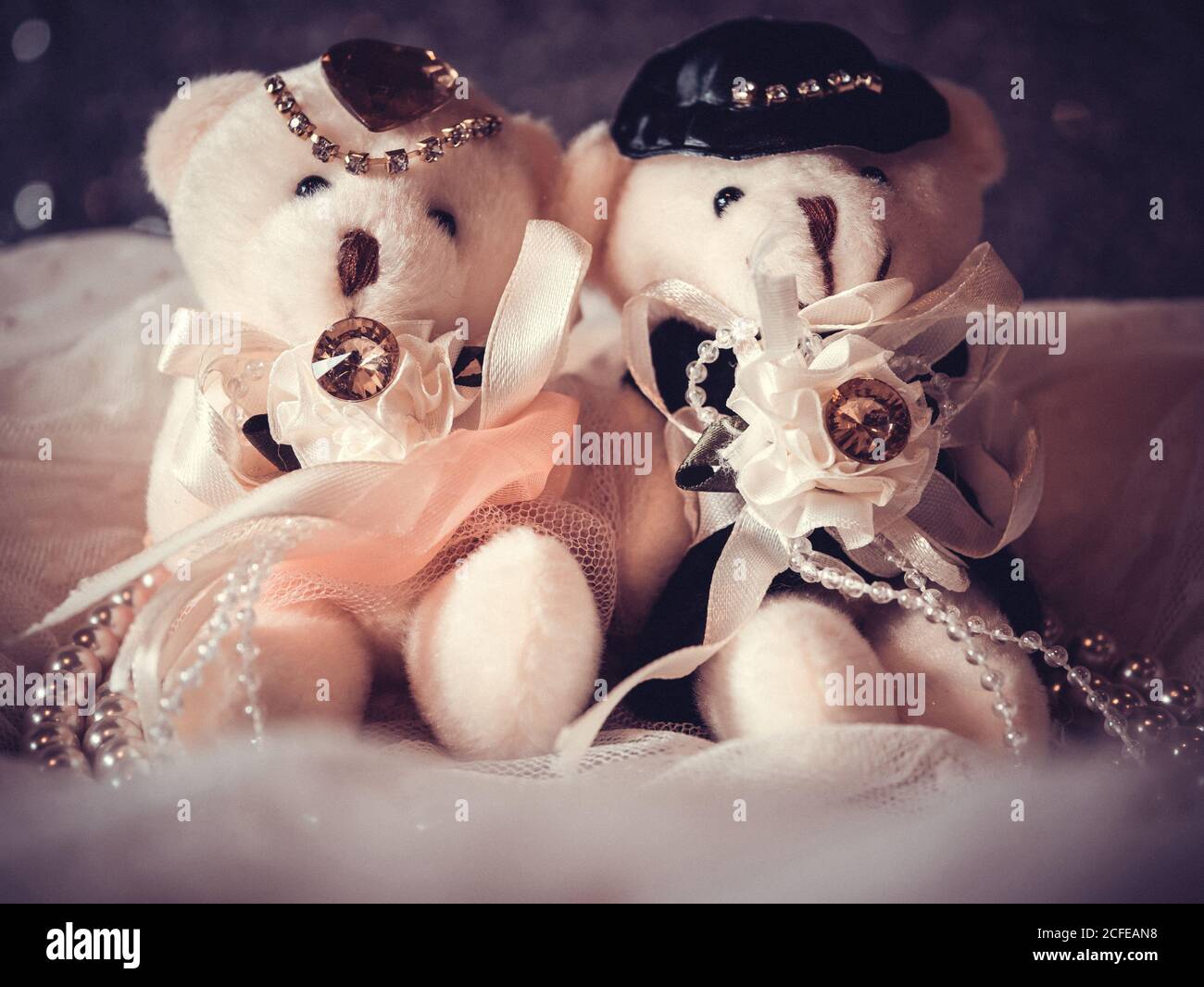 love concept : couple teddy bears in wedding dress for valentine greeting card with bokeh background. love concept wallpaper. wedding invitation card Stock Photo