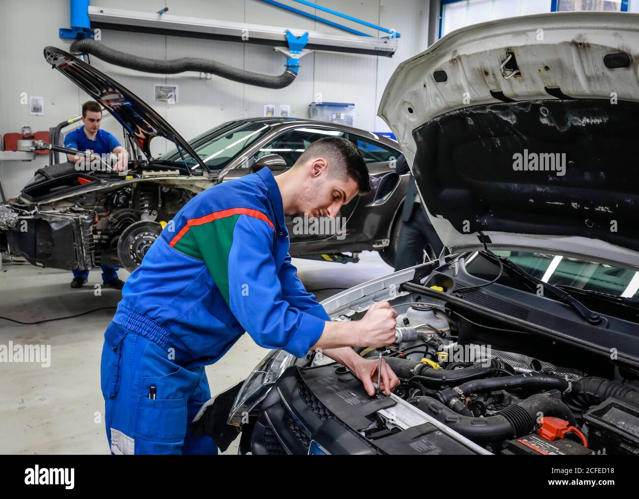 Ennepetal, North Rhine-Westphalia, Germany - Apprenticeship as body and vehicle construction mechanic, here at Frischkorn body + paint center. Stock Photo