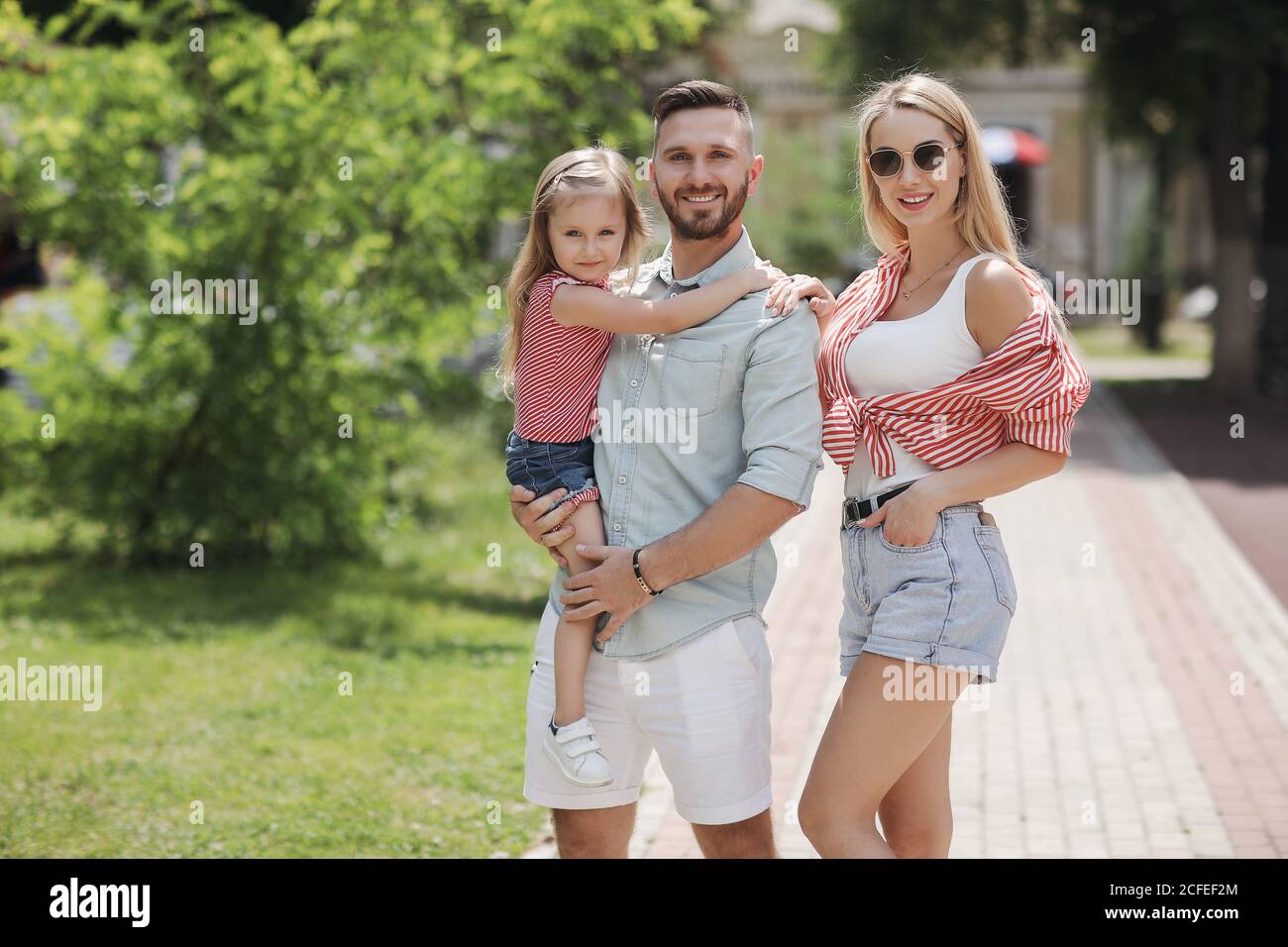 Happy family outdoor at the park Stock Photo - Alamy