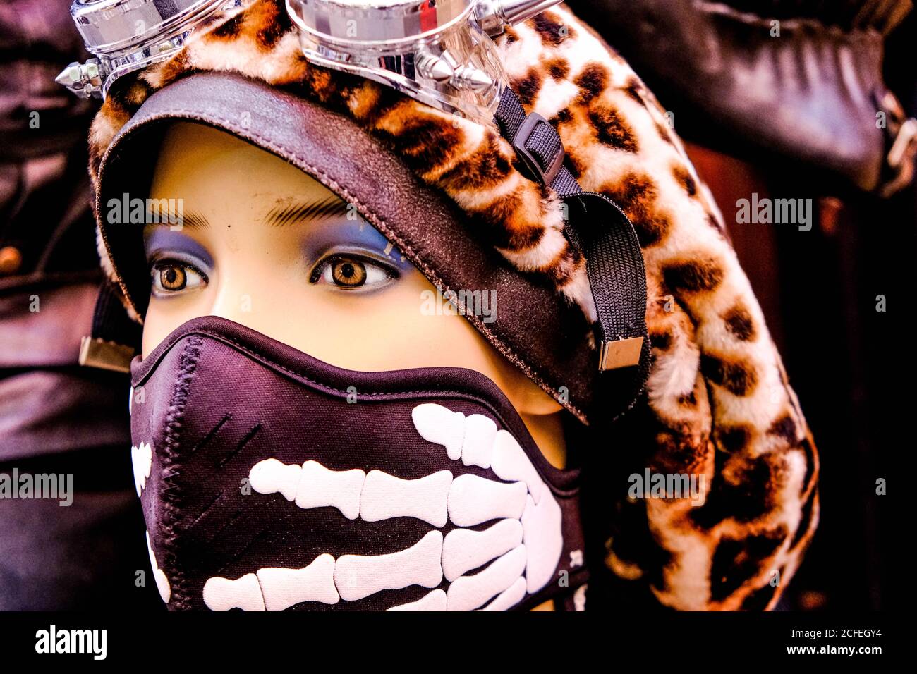 Head Shot Of A Mannequin Wearing A Face Covering And Leopard Print Sixties Hat, Camden Market London UK Stock Photo