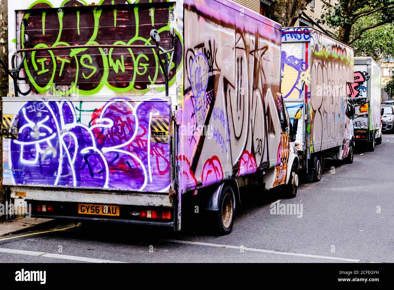 Graffiti Painted Vans Parked In Camden Market London, UK, With No People Stock Photo
