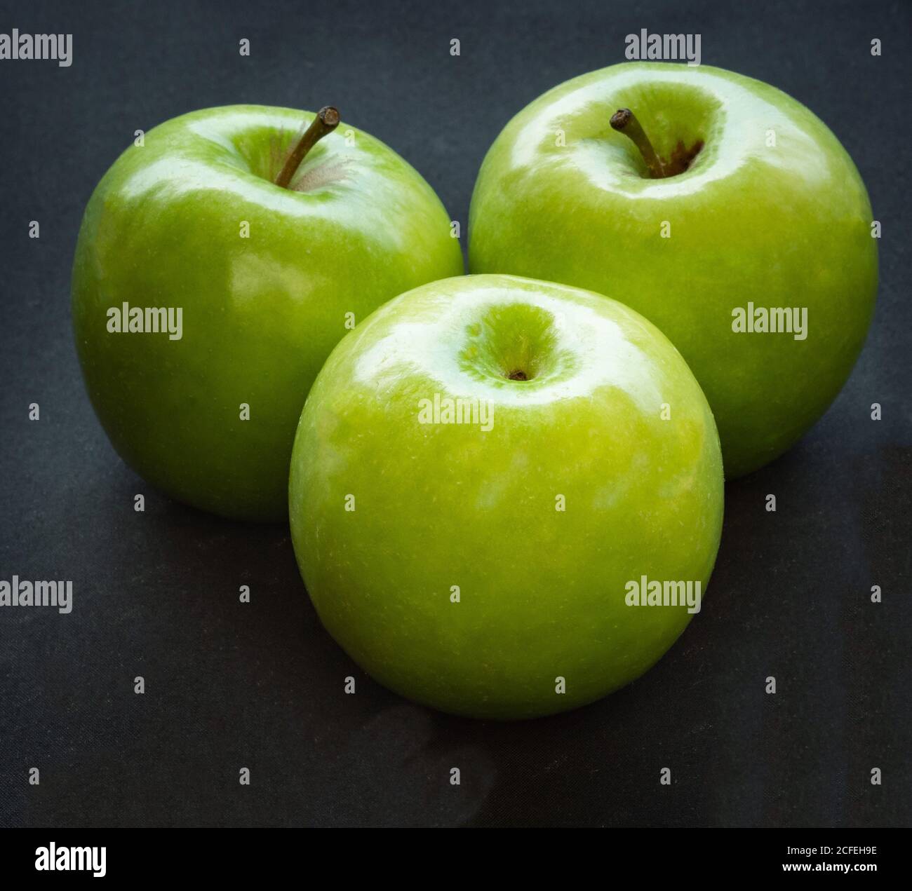 Green apples on dark background Stock Photo