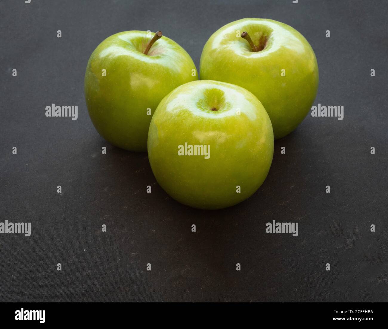 Green apples on dark background Stock Photo