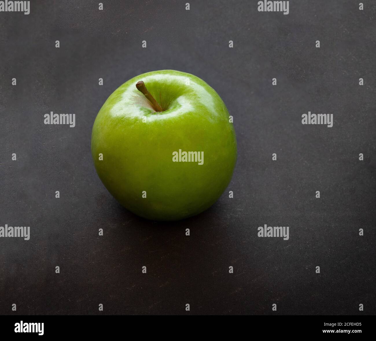 Green apples on dark background Stock Photo