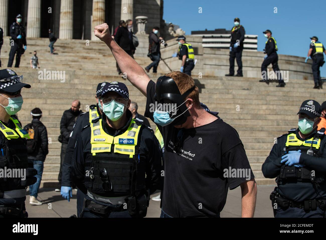 Melbourne, Australia 5 Sep 2020, a protestor in a Darth Vader mask holds his first in the air at the Freedom Day Anti-mask and anti lockdown protest on the steps of the Shrine of Remembrance in Melbourne Australia. Credit: Michael Currie/Alamy Live News Stock Photo