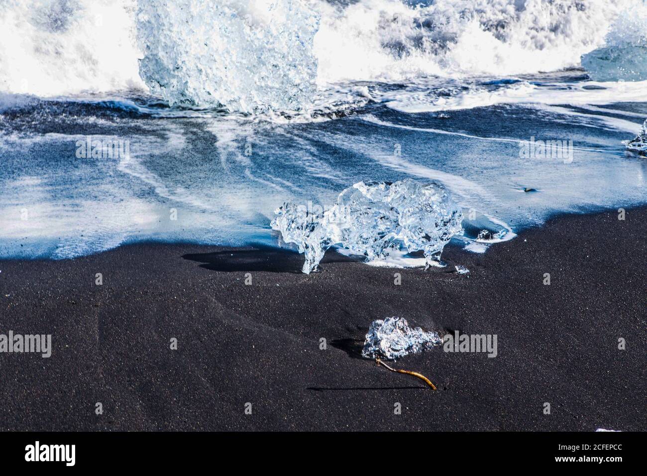 Diamond beach, big ice rocks on a black beach, at south coast of Iceland, on a sunny day, summer time. Stock Photo
