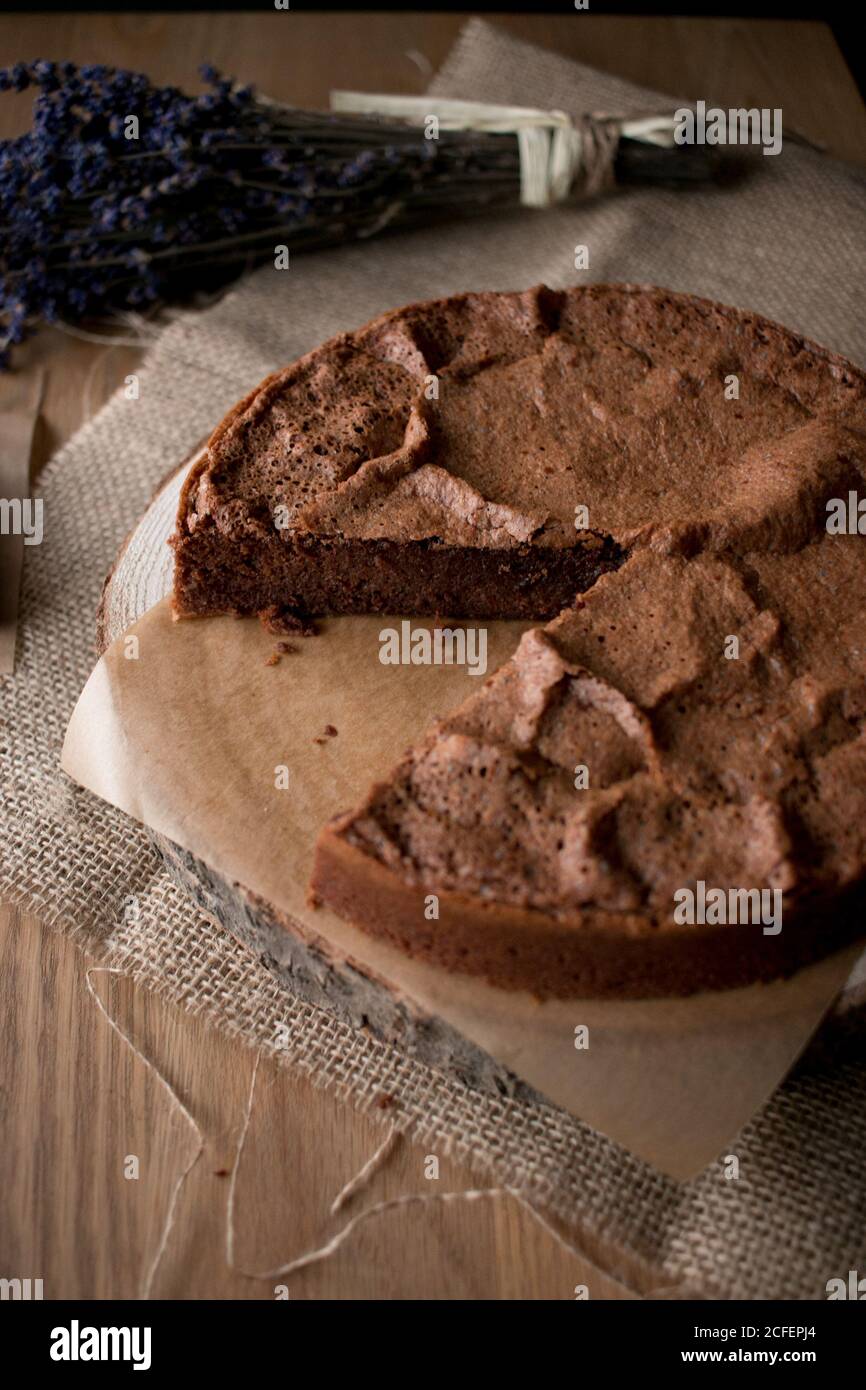 Beautiful delectable gluten free chocolate cake in a timber tabletop in the kitchen Stock Photo