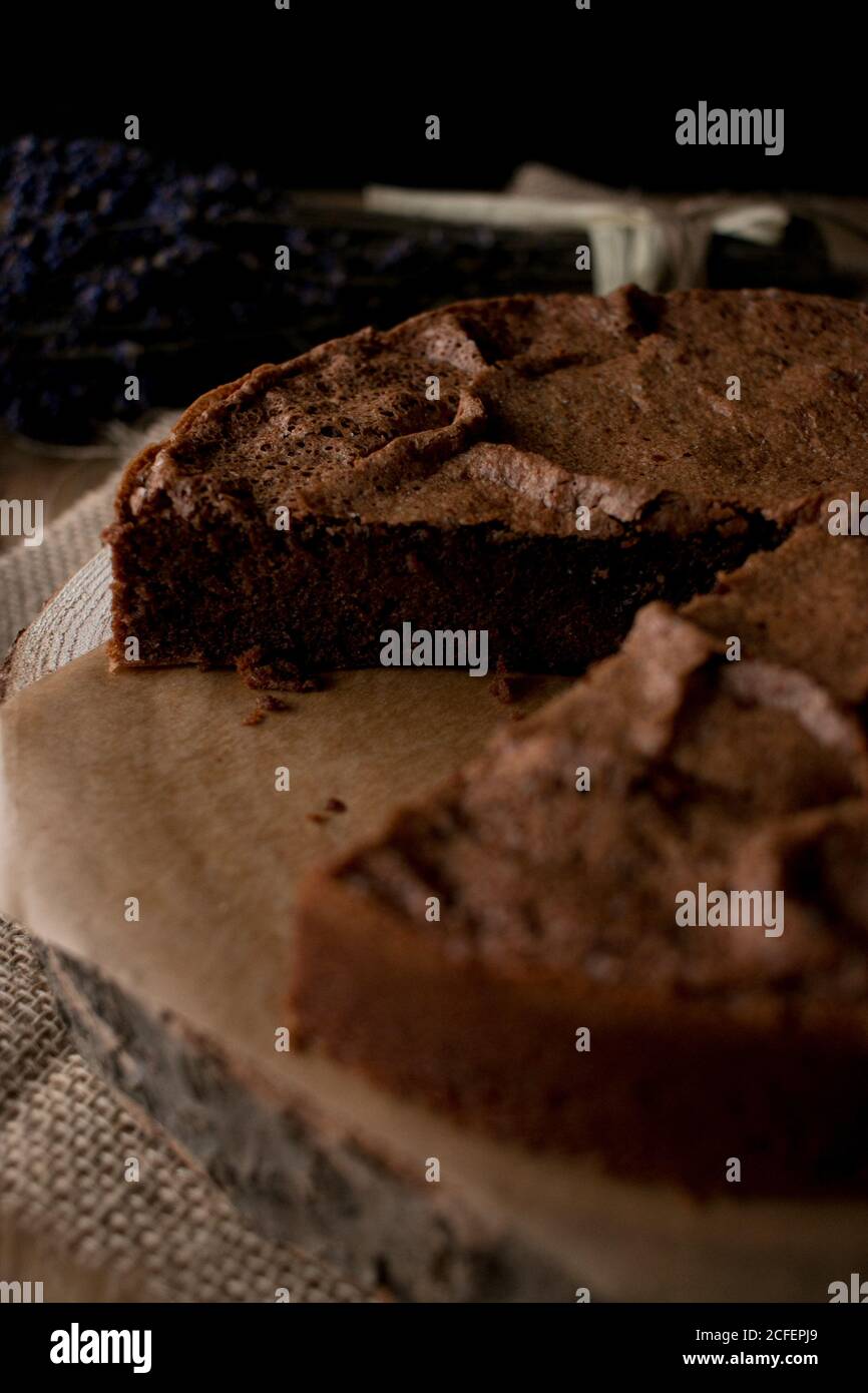 Beautiful delectable gluten free chocolate cake in a timber tabletop in the kitchen Stock Photo
