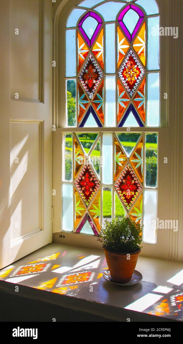 Colorful vintage stained glass window interior with light