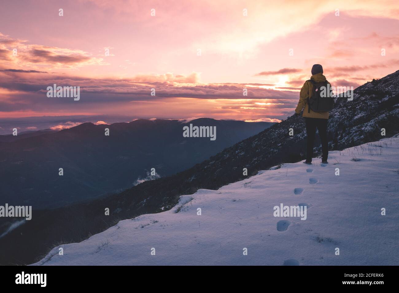 anonymous tourist on snowy mountain Stock Photo
