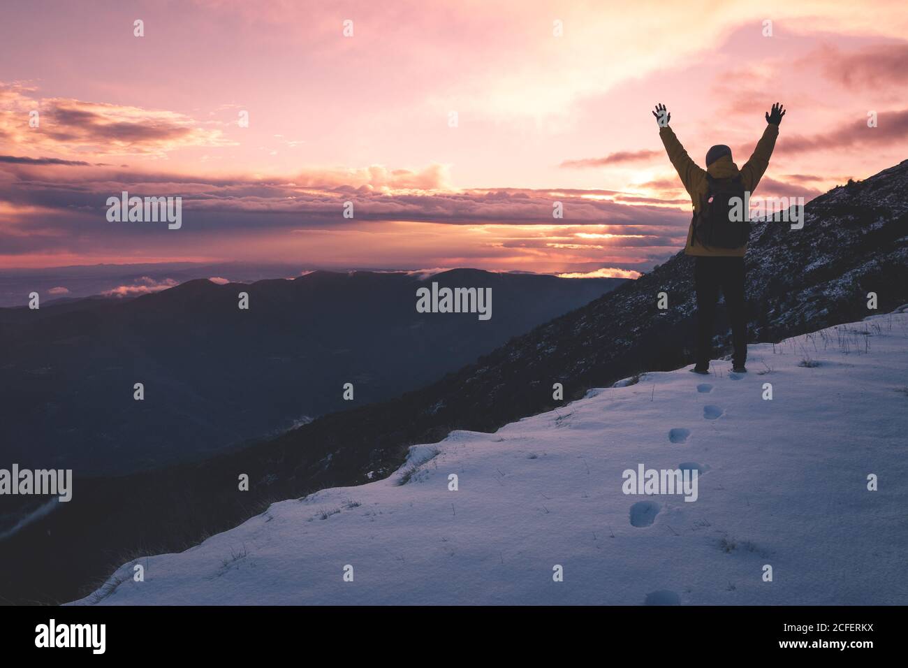 anonymous tourist on snowy mountain Stock Photo