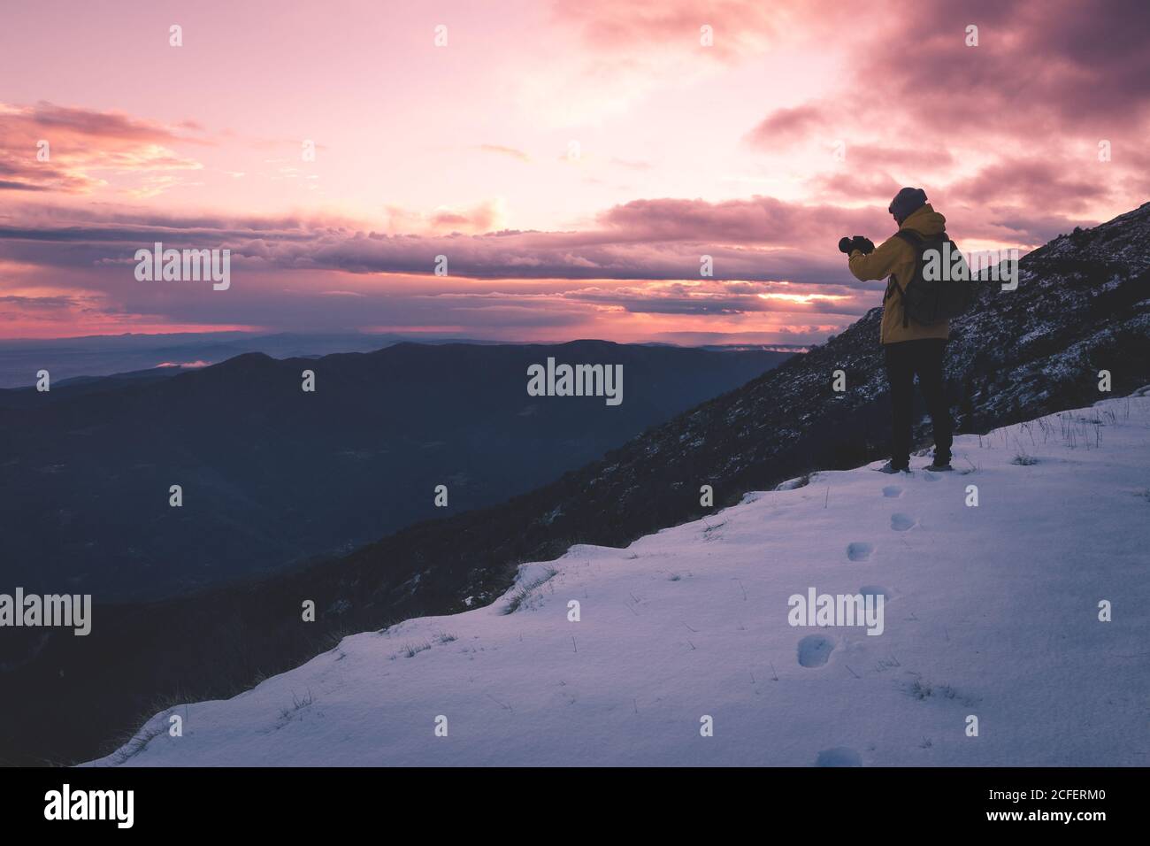 anonymous tourist on snowy mountain Stock Photo