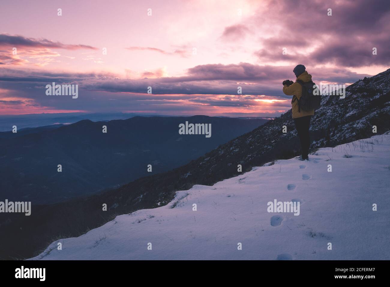 anonymous tourist on snowy mountain Stock Photo