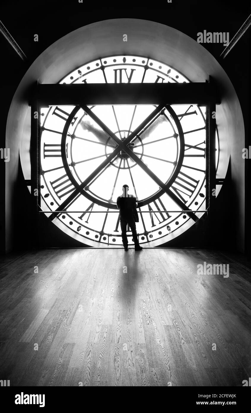 Clock with a silhouette of a man, Musée d'Orsay, Paris,  b&w image. Stock Photo