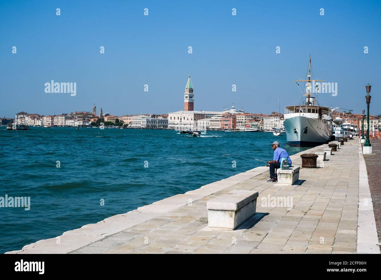 Atmosphere around Venice on Saturday 5 September 2020 at , Venice. General View of the Waterfront with large yachts moored . Picture by Julie Edwards. Stock Photo