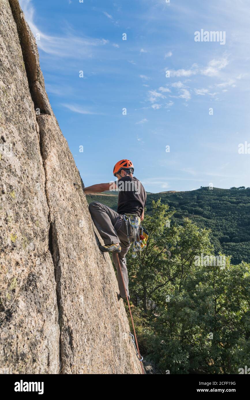 Man climbing a rock hi-res stock photography and images - Alamy