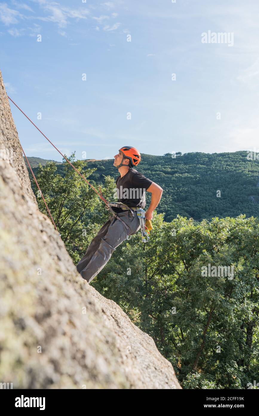 Man climbing a rock hi-res stock photography and images - Alamy