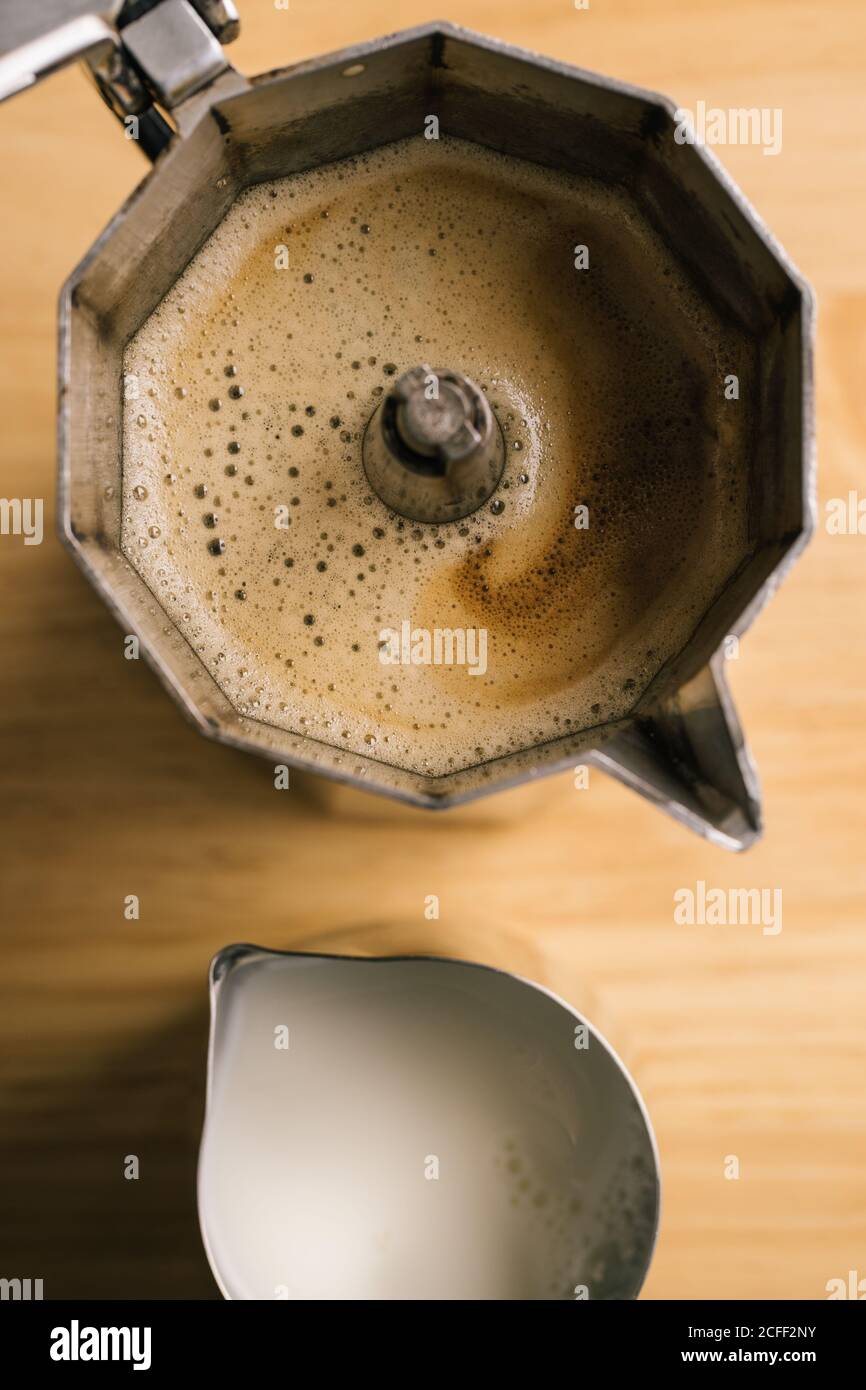 Geyser coffee maker and milk pitcher Stock Photo