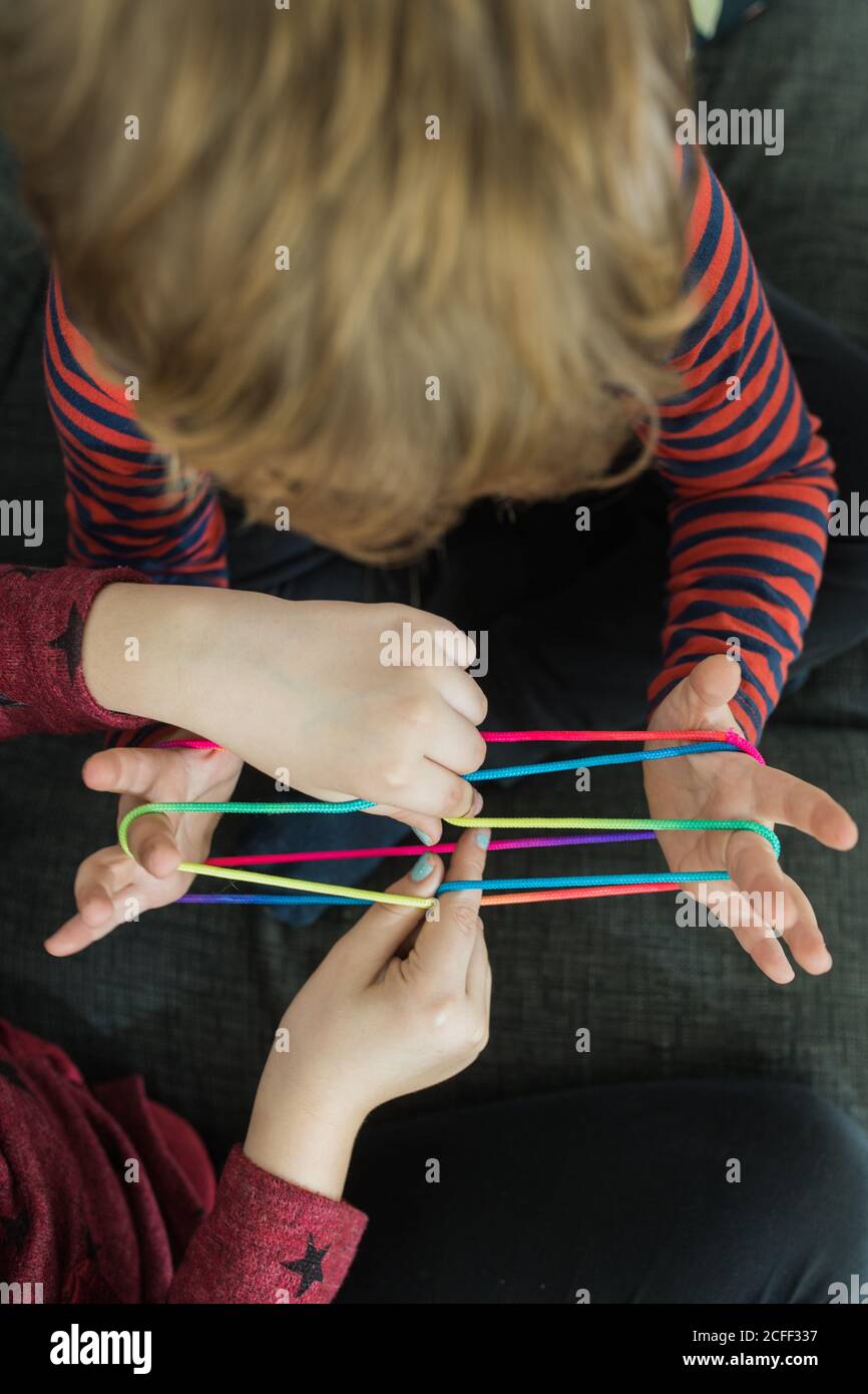 Smart children using rubber bands for game Stock Photo Alamy