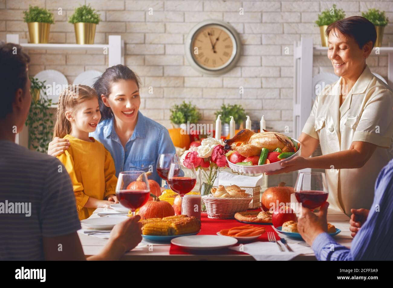 Happy Thanksgiving Day! Autumn feast. Family sitting at the table and