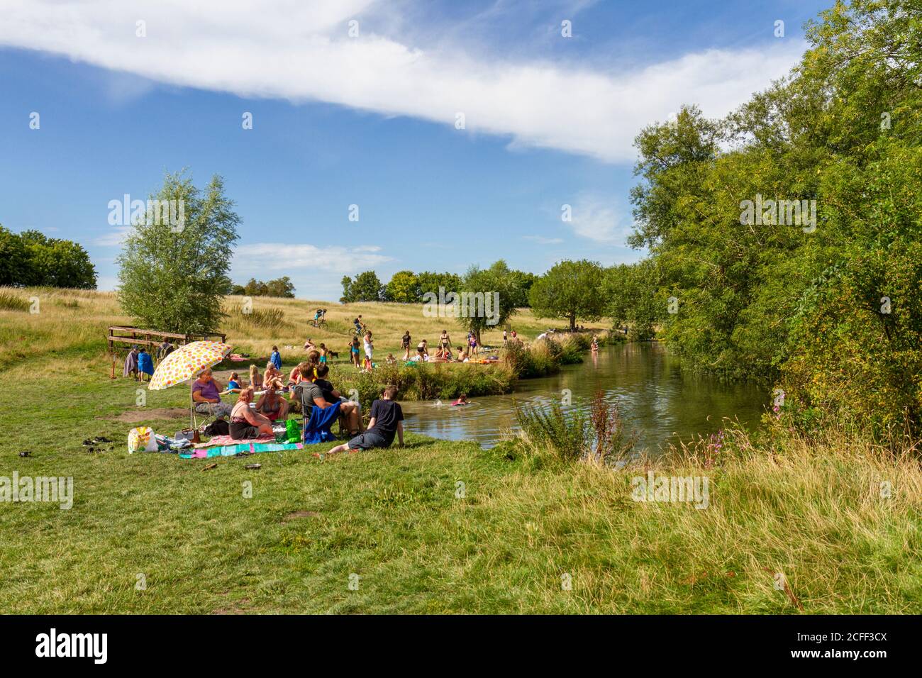 People enjoying the summer weather during the Covid summer of 2020 on Grantchester Meadows, Grantchester, Cambridgeshire, UK. Stock Photo