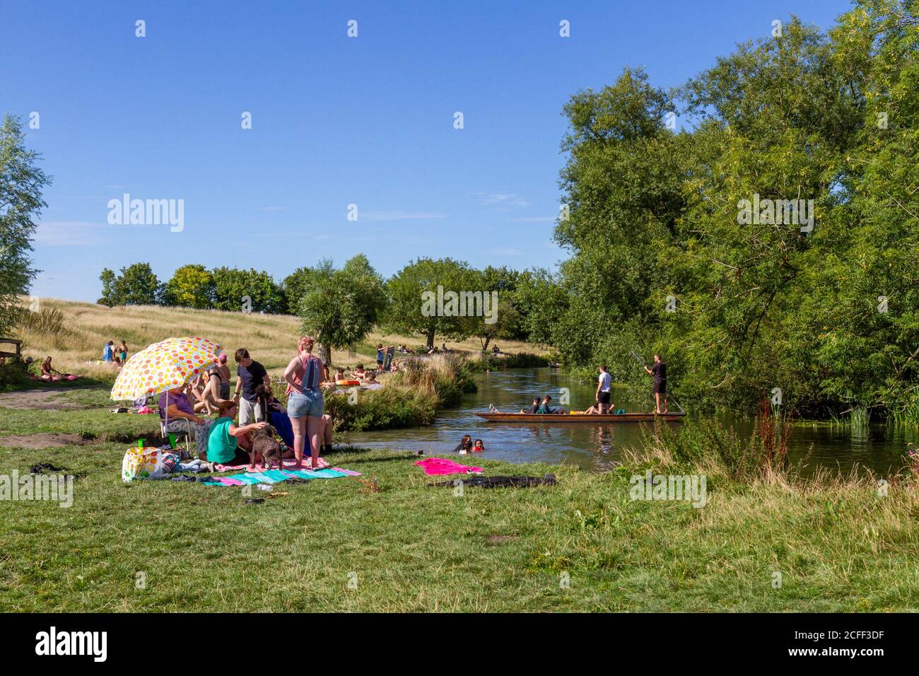People enjoying the summer weather during the Covid summer of 2020 on Grantchester Meadows, Grantchester, Cambridgeshire, UK. Stock Photo