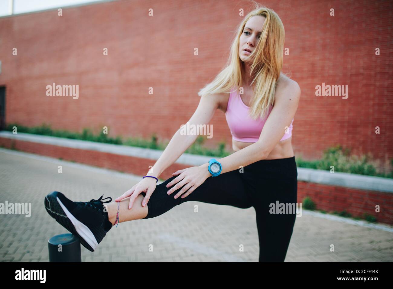 Blonde woman stretching hi-res stock photography and images - Alamy