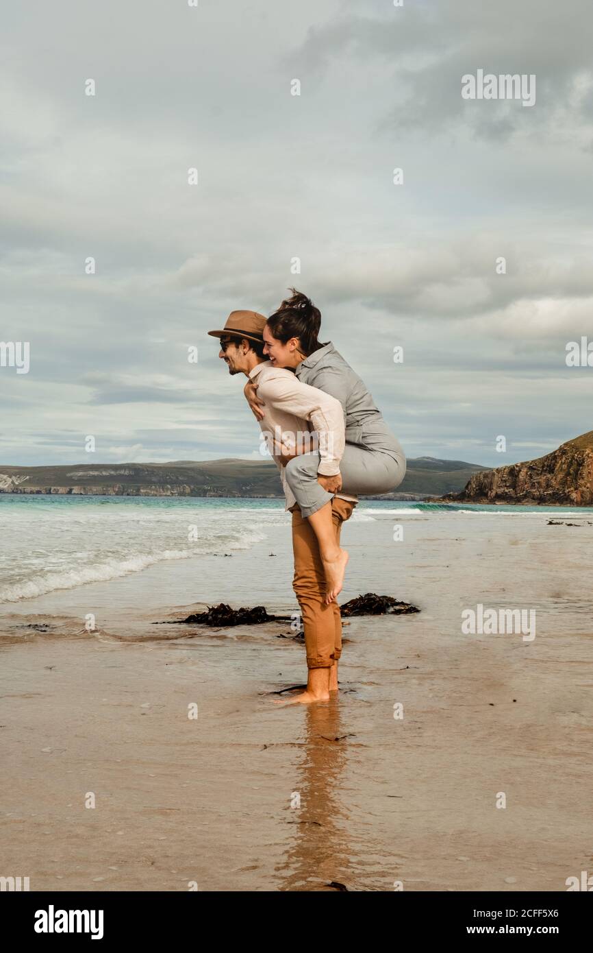 Happy couple having fun on Scottish coast Stock Photo
