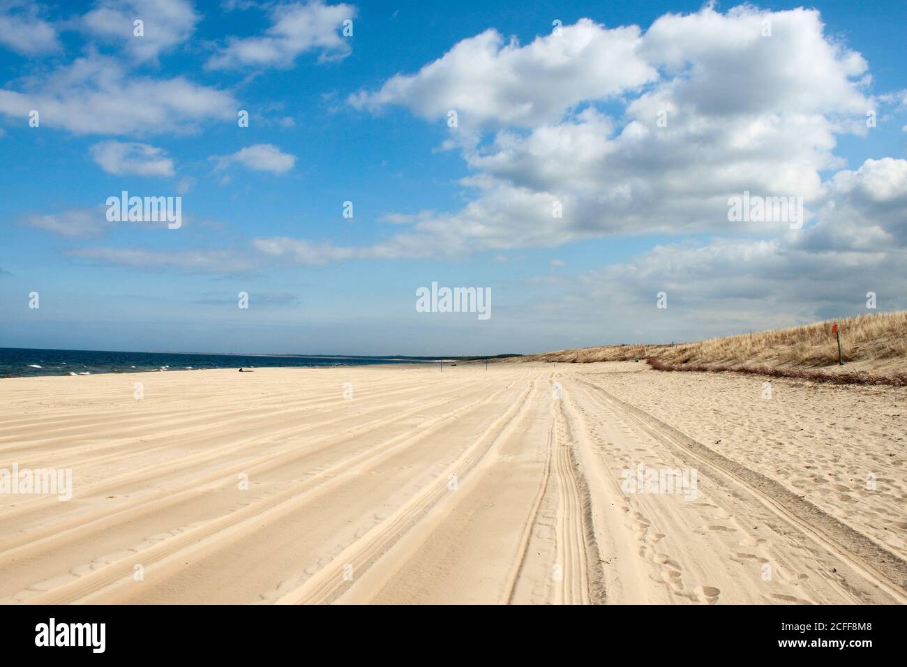 Beach landscape with blue sky and white sand Stock Photo - Alamy